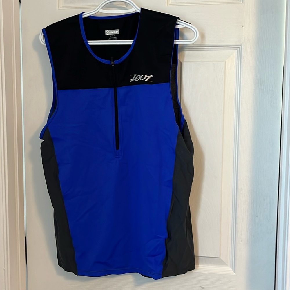 Triathlon suit/top. Used twice. Selling because is now too big for my husband.